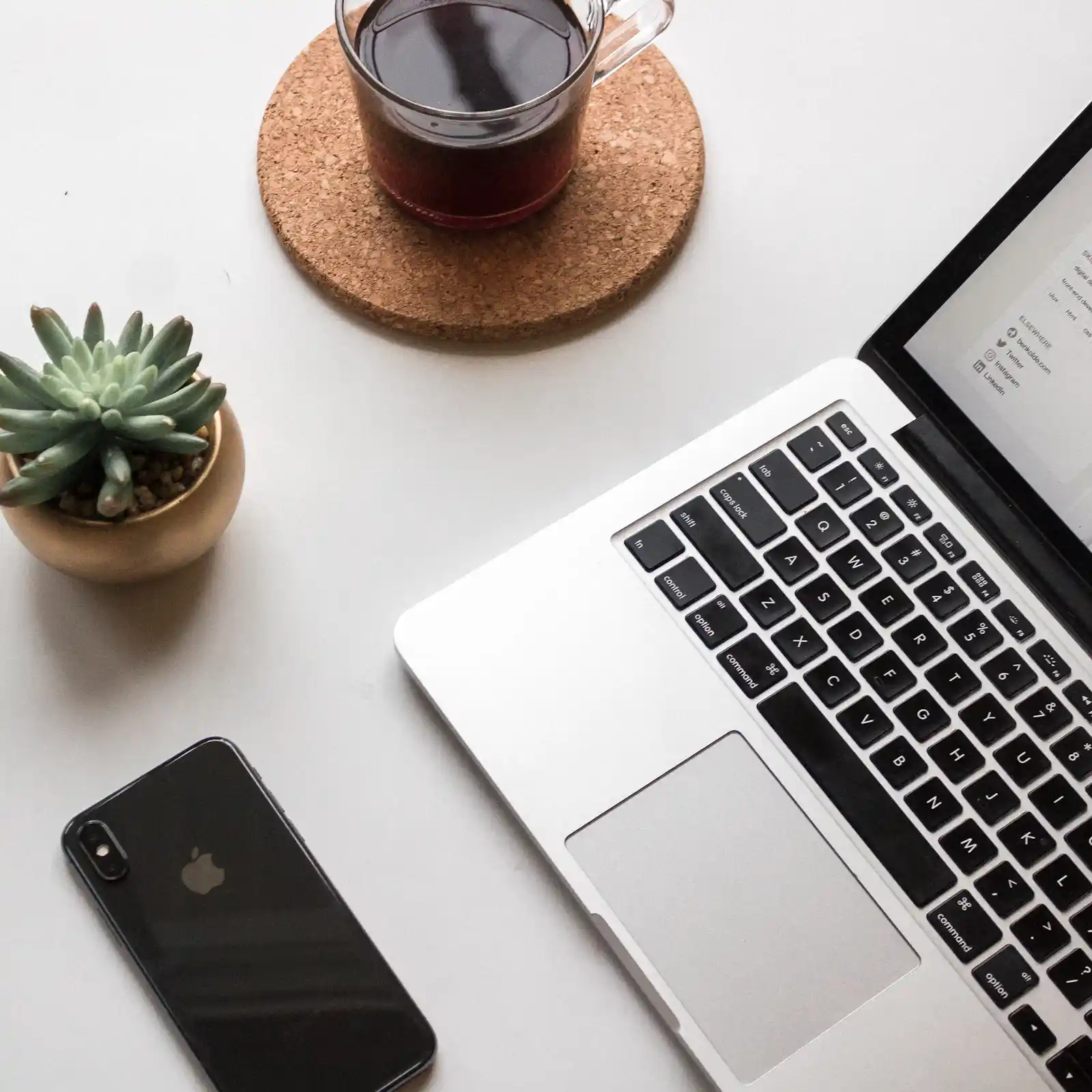 Laptop and mobile phone on a tidy office desk