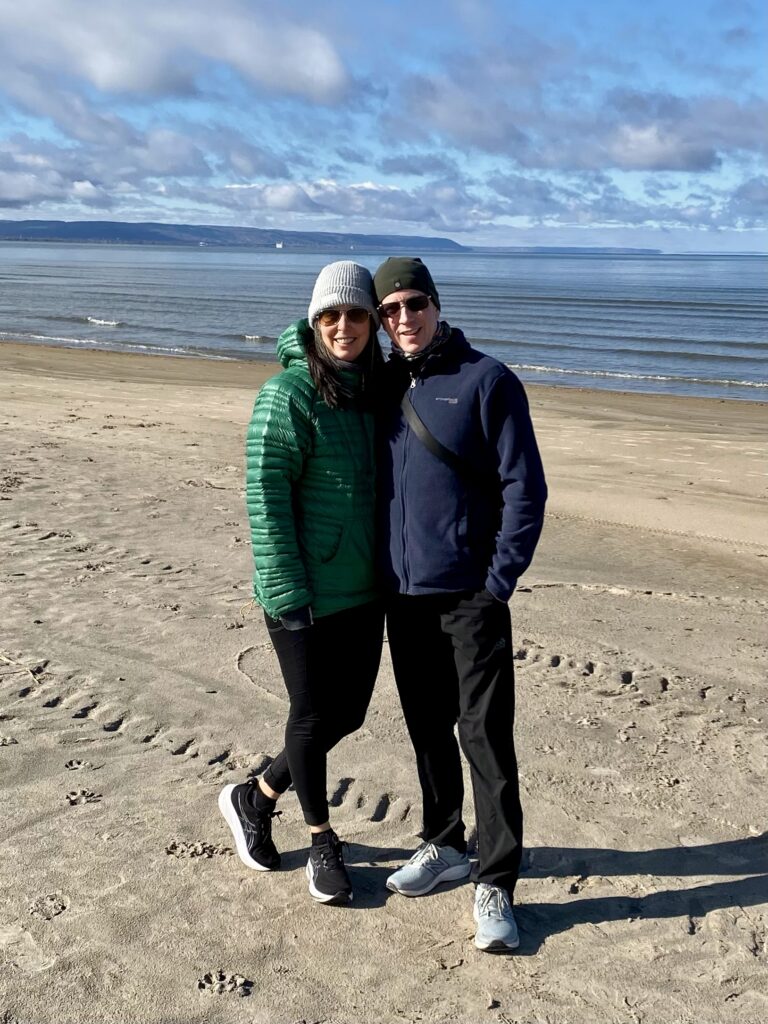Adam Growe and Julie Bays walking at Wasaga Beach